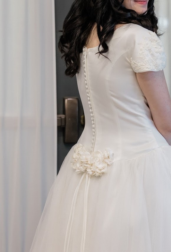 Restored vintage wedding gown — delicate button back and floral hip detail